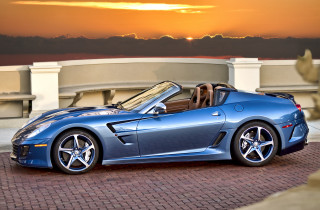 Blue sports car sunset building - the sun setting behind free wallpaper
