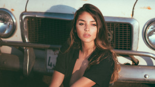 Woman car olive skin portrait - free vintage wallpaper