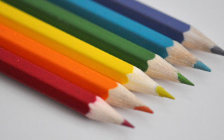 Colored pencils row white table - pastell free wallpaper