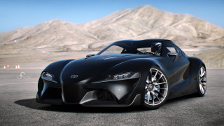Black sports car mountains blue - a blue sky in the foreground free wallpaper