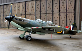 Small green airplane building open - donald sherwood free wallpaper