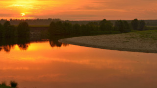 Sunset river bridge trees grassy - a grassy area in the foreground free wallpaper