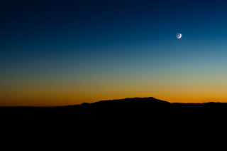 Sunset half moon mountains clouds - a half moon in the sky free wallpaper