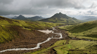 River valley mountains cloudy sky 5 - a lush green valley under a cloudy sky free wallpaper