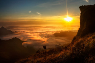 Sunset mountain hill backpack city - a few cloud below free wallpaper