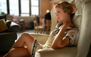 Woman sitting couch livingroom blurry - emma geary free wallpaper