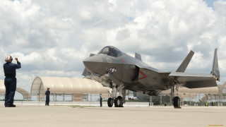 Fighterjet man suit tarmac cloudy - top of an airport tarmac next free wallpaper