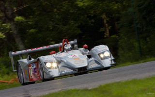 Racecar road trees person motionblur - a race car free wallpaper