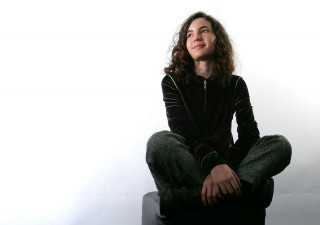 Woman sitting stool legs crossed - kai carpenter free wallpaper for desktop