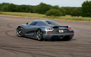 Silver sports car driving motion - excessivism free wallpaper for desktop