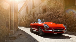 Red sports car stone building - a stone building free wallpaper