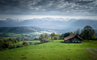 Small house grassy hill mountains - a small house free wallpaper