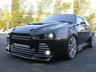 Black sports car parking lot - the background and a building in the background free wallpaper