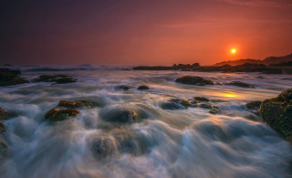 Sunset water rocks island bridge - a small island in the distance free wallpaper for desktop