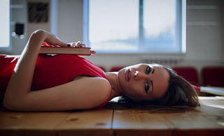 Woman laying book window portrait - a window in the background free wallpaper