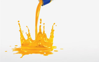 Yellow liquid pouring blue cup - a white background free wallpaper