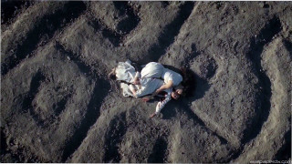 Man laying sand cellphone hands - the sand free wallpaper for desktop