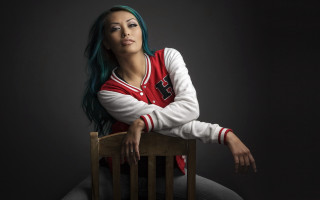 Blue haired woman chair crossed - christian hilfgott brand free wallpaper for desktop