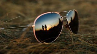 Sunglasses reflection couple grass sunset - a pair of sunglasses free wallpaper