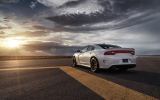 White car cloudy sky sunset - a road under a cloudy sky free wallpaper