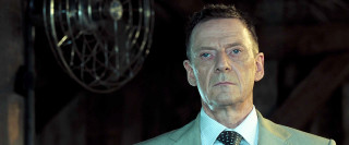 Man suit tie serious expression 8 - his face and shoulders free wallpaper