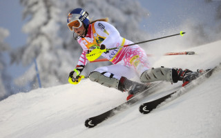 Woman yellow ski suit skiing - eva švankmajerová free wallpaper