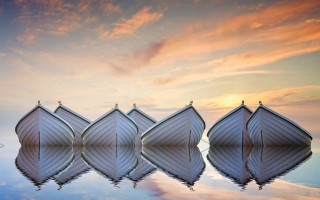 Boats lake sunset symmetry cloudy - top of a lake under a cloudy sky free wallpaper for desktop