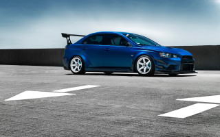 Blue car parking lot white - a black wall free wallpaper