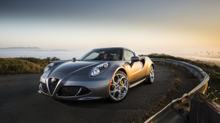 Silver sports car driving hill 2 - fog in the background free wallpaper