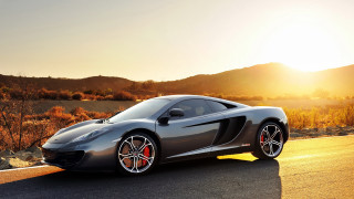 Grey sports car mountain sunset 2 - a grey sports car free wallpaper
