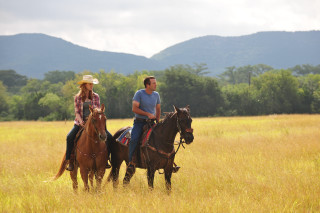 Horse riding couple mountains field - a cloudy day free wallpaper