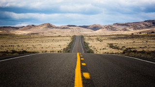 Deserted road mountains cinematic beach - straight free wallpaper for desktop