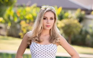 Woman polka dots sunglasses pool - promotional image free wallpaper