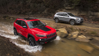 Two vehicles muddy road forest - rock and trees free wallpaper