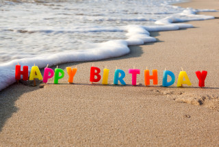Birthday candle beach ocean waves 2 - the word happy birthday free wallpaper