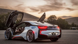 Bmw sports car mountains sunset - a parking lot free wallpaper