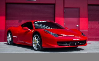Red sports car red building - a red wall behind free wallpaper