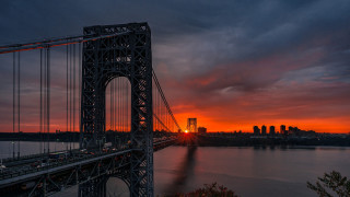 Bridge sunset city mountains horizon - a red sky in the background free wallpaper
