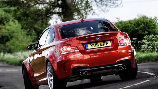 Red car forest road cherryblossoms - a license plate free wallpaper for desktop