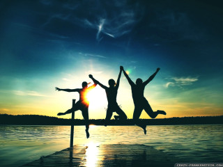 People jumping dock sunset silhouette - cheerful free wallpaper