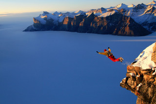Man jumping cliff snowboard mountain - fabien charuau free wallpaper