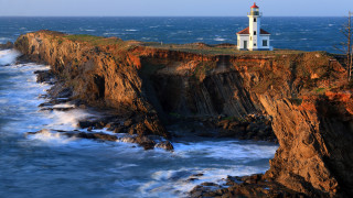 Lighthouse cliff ocean waves sunset 2 - the ocean free wallpaper