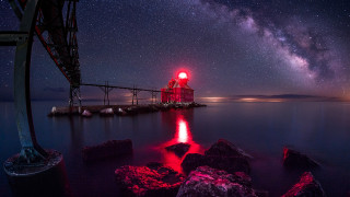 Lighthouse rocky shore night stars 3 - red light free wallpaper