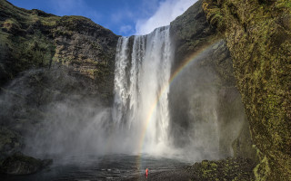 Rainbow waterfall cloudy sky forest - a rainbow in the sky above free wallpaper