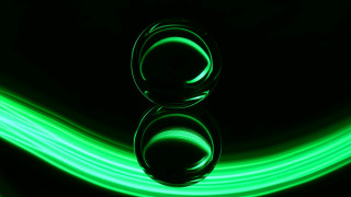 Green light reflection black surface - a black surface free wallpaper