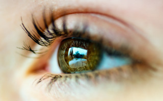 Eye building reflection macro blurry - a close up of a persons eye free wallpaper