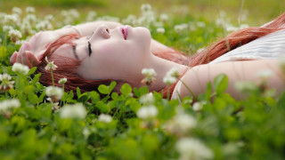 Woman lying flowers closed eyes - dreamlike free wallpaper for desktop