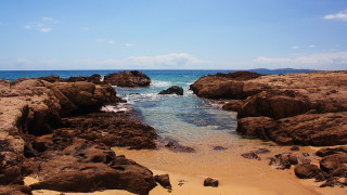 Rocky beach ocean sky clouds - a rocky beach free wallpaper