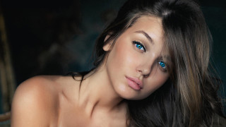 Blue eyes woman blowing hair - photorealism free wallpaper for desktop