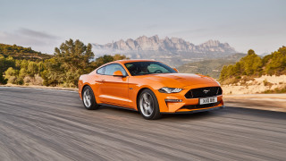 Bright orange mustang mountains trees - promotional free wallpaper for desktop